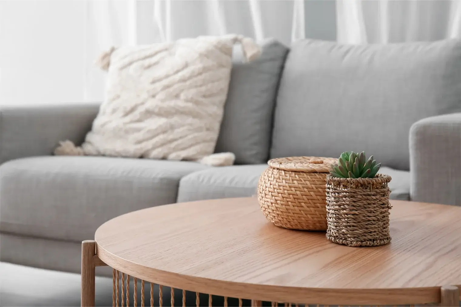 Staged living space holding neutral furniture and catching natural light inside an Ivory on Long Creek apartment home.