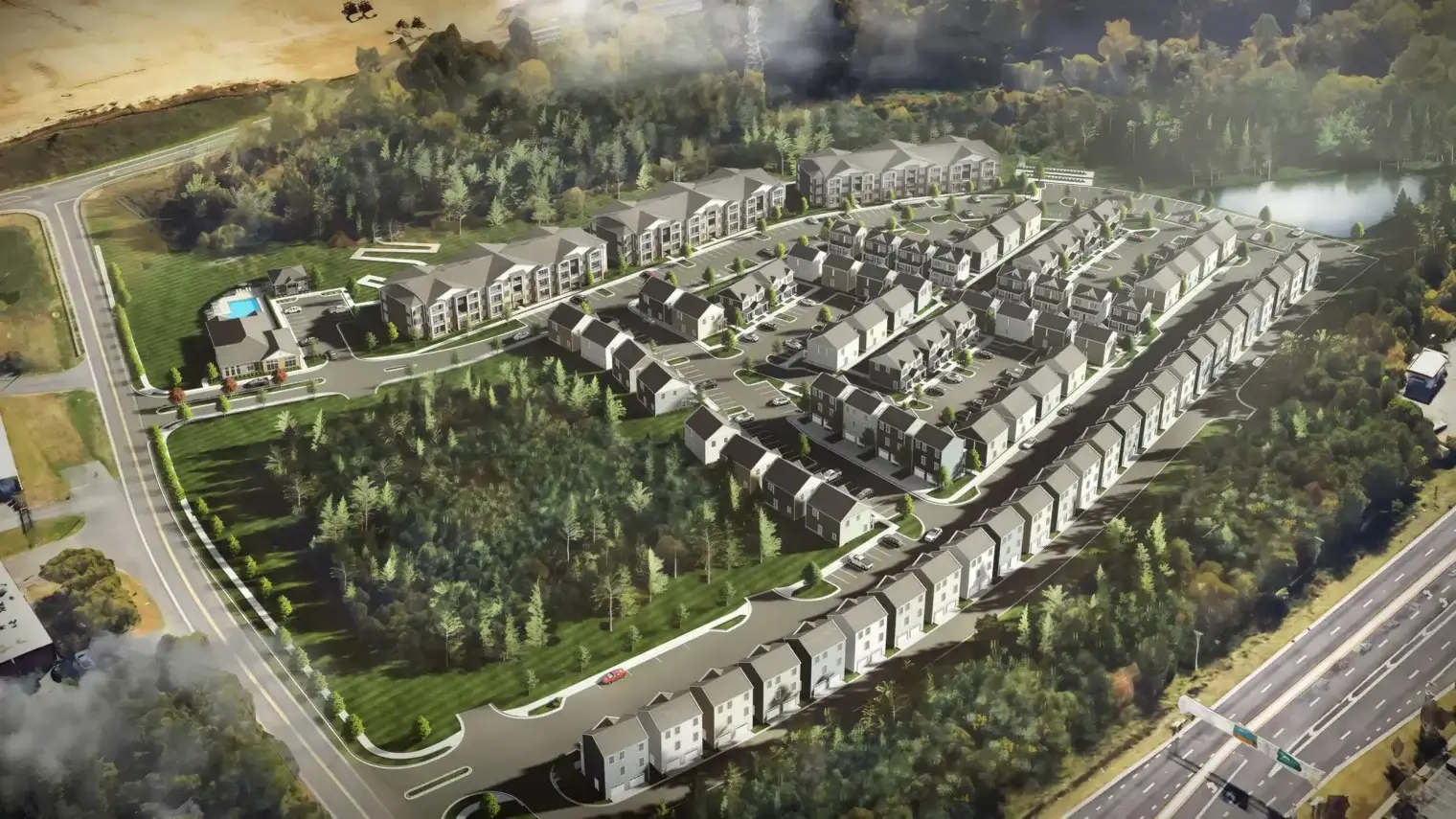 Cottage homes, apartments, and landscaped green space filling an aerial view of the Ivory on Long Creek community.