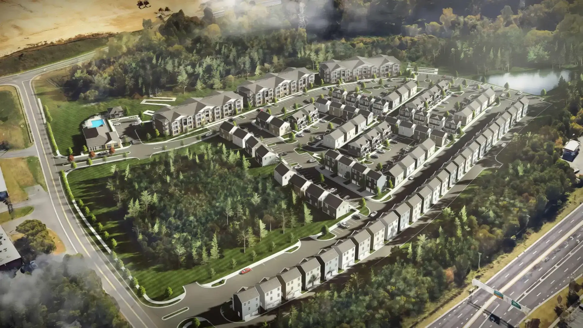 Cottage homes, apartments, and landscaped green space filling an aerial view of the Ivory on Long Creek community.