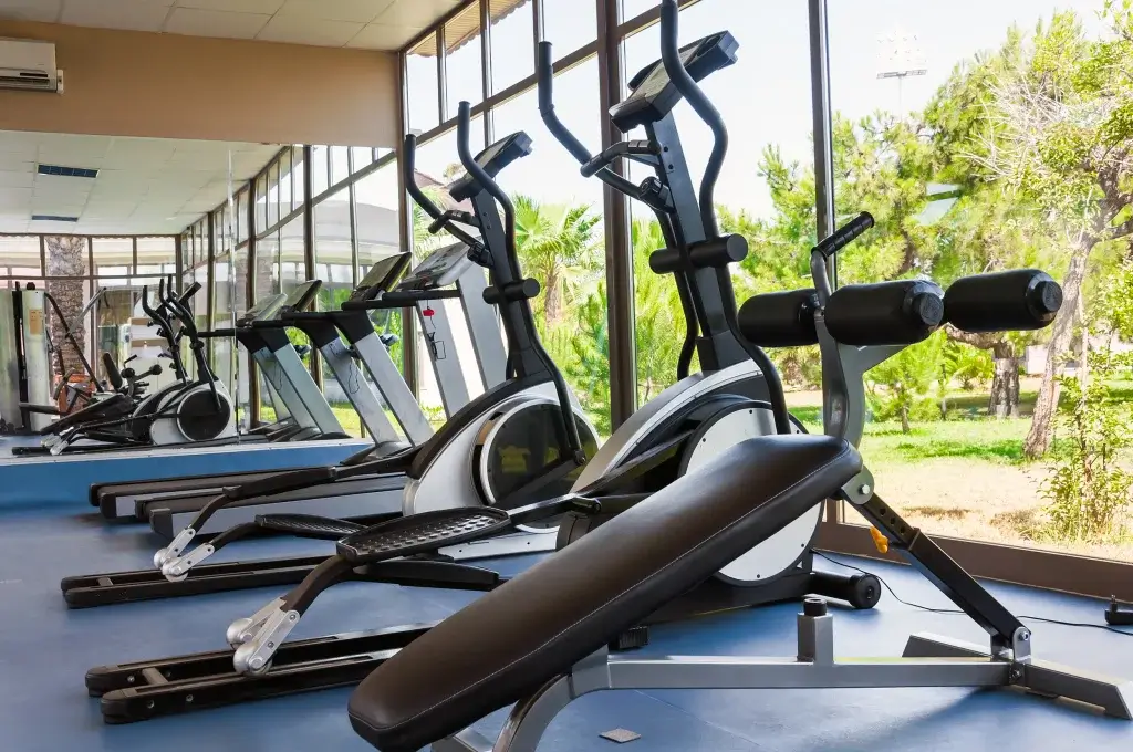 Cardio machines and free weights lining bright windows inside the Ivory on Long Creek fitness center in Gastonia, NC.