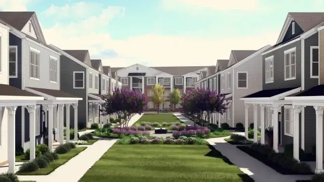 Contemporary apartment buildings framing a landscaped central courtyard and walkways at Ivory on Long Creek, Gastonia, NC.