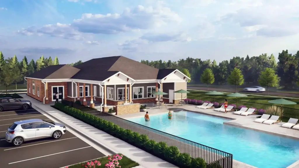 Resort-style pool and paved sun deck stretching beside the apartment buildings and greenery at Ivory on Long Creek.