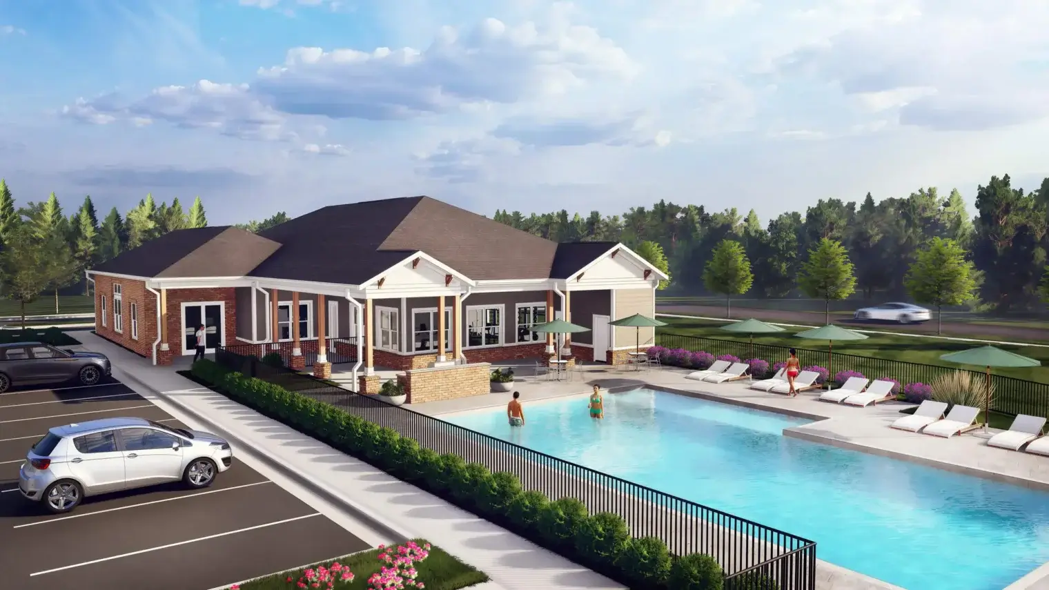 Resort-style pool and paved sun deck stretching beside the apartment buildings and greenery at Ivory on Long Creek.