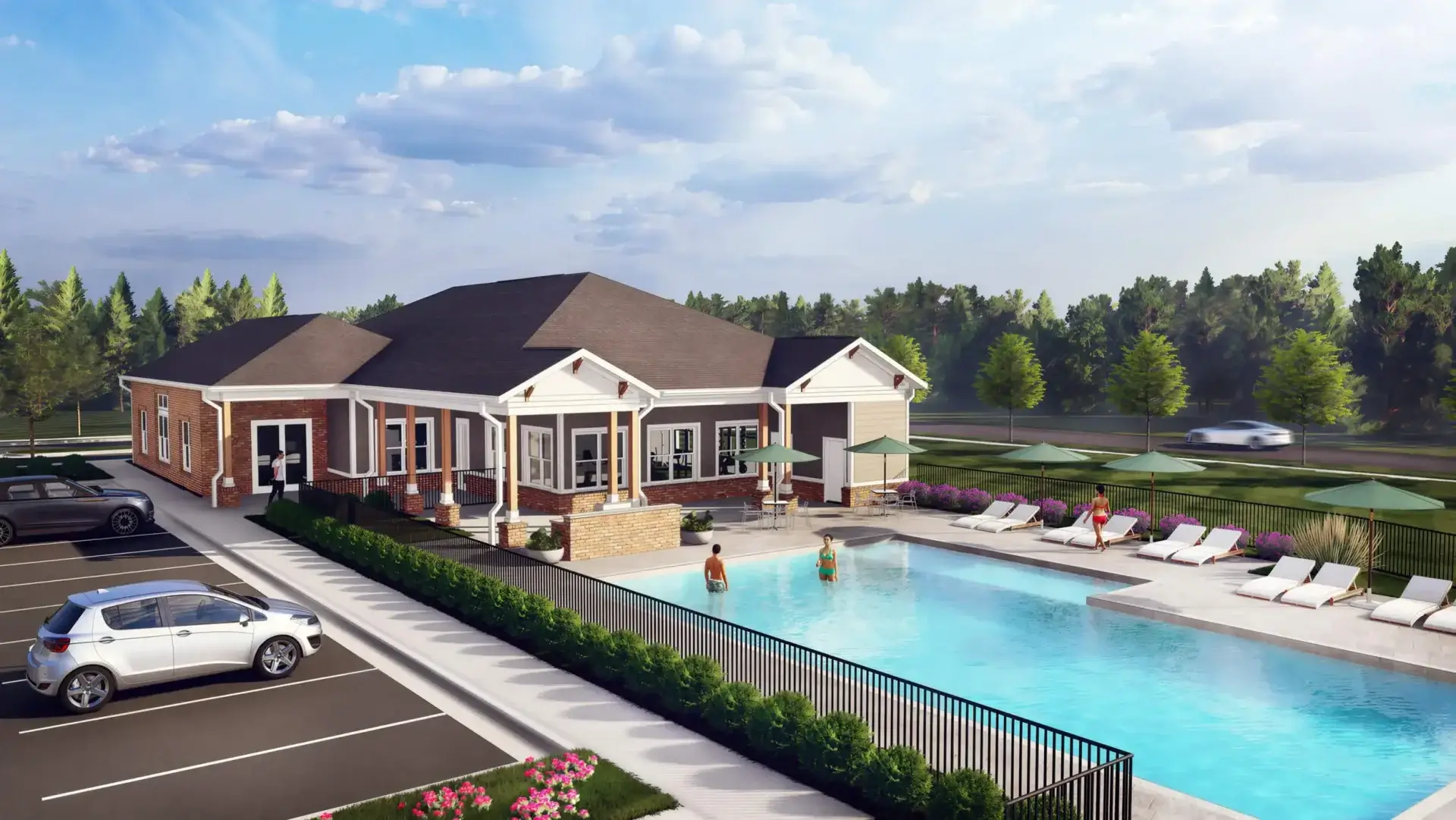 Resort-style pool and paved sun deck stretching beside the apartment buildings and greenery at Ivory on Long Creek.