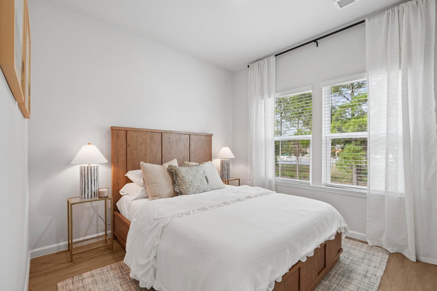 bright bedroom with bed and nightstands