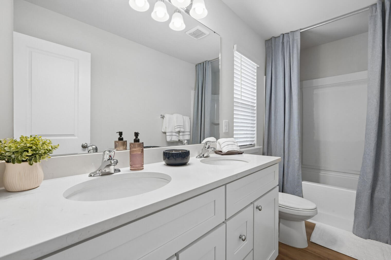 primary bedroom with double sinks